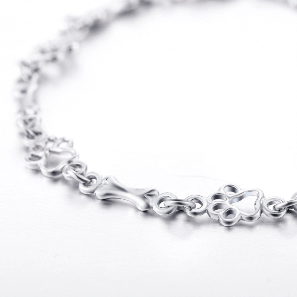 Bracelet avec pattes de chien et os, édition limitée | Or blanc