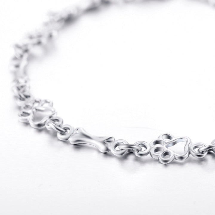 Bracelet avec pattes de chien et os, édition limitée | Or blanc