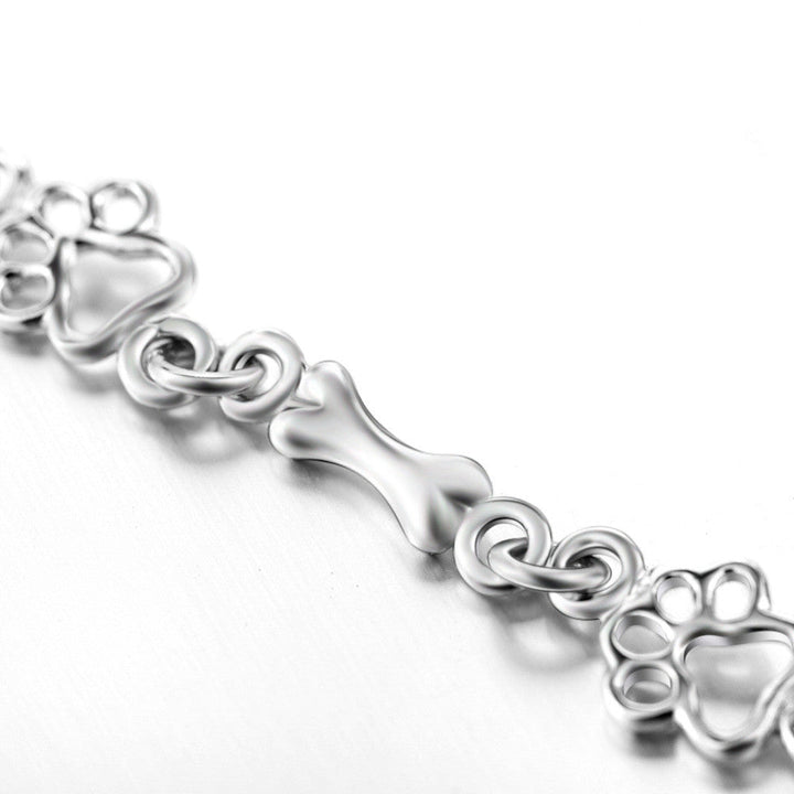 Bracelet avec pattes de chien et os, édition limitée | Or blanc