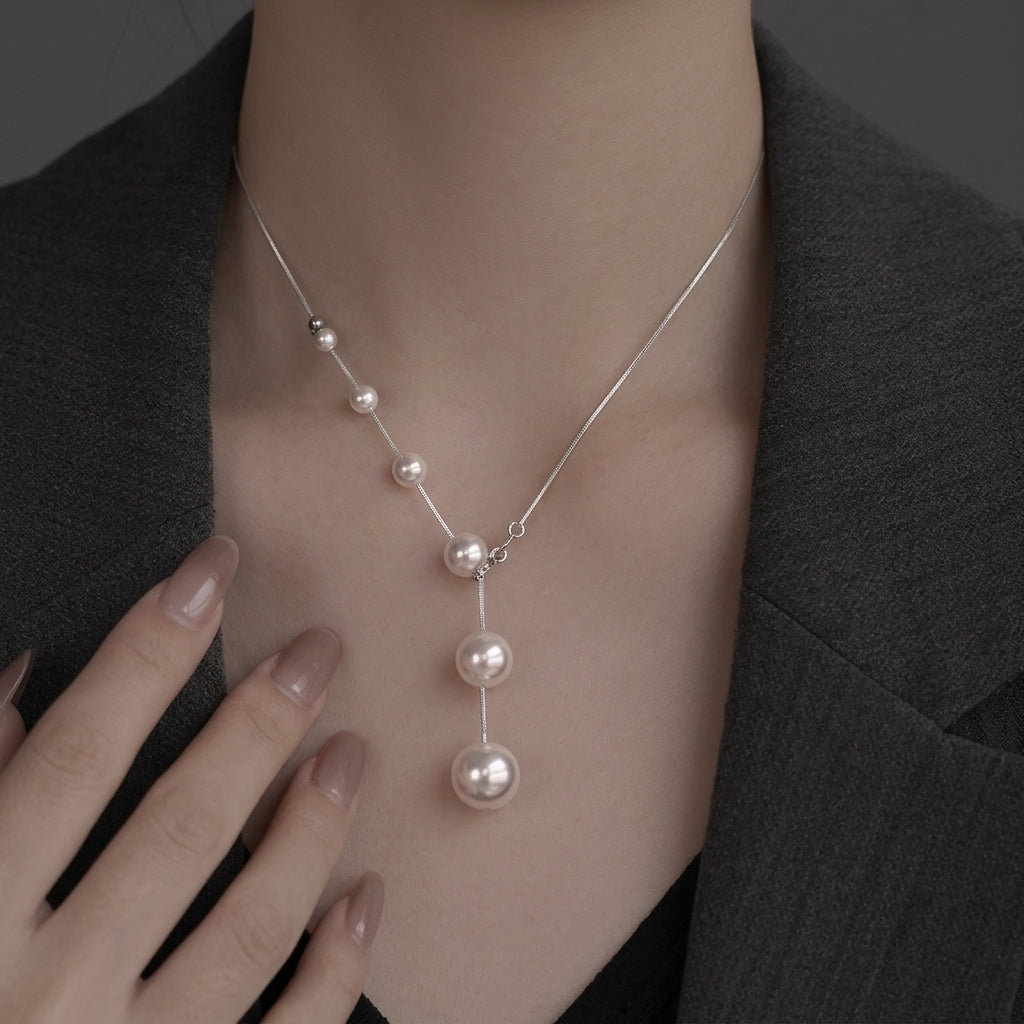 Collier élégant avec perles suspendues | Or