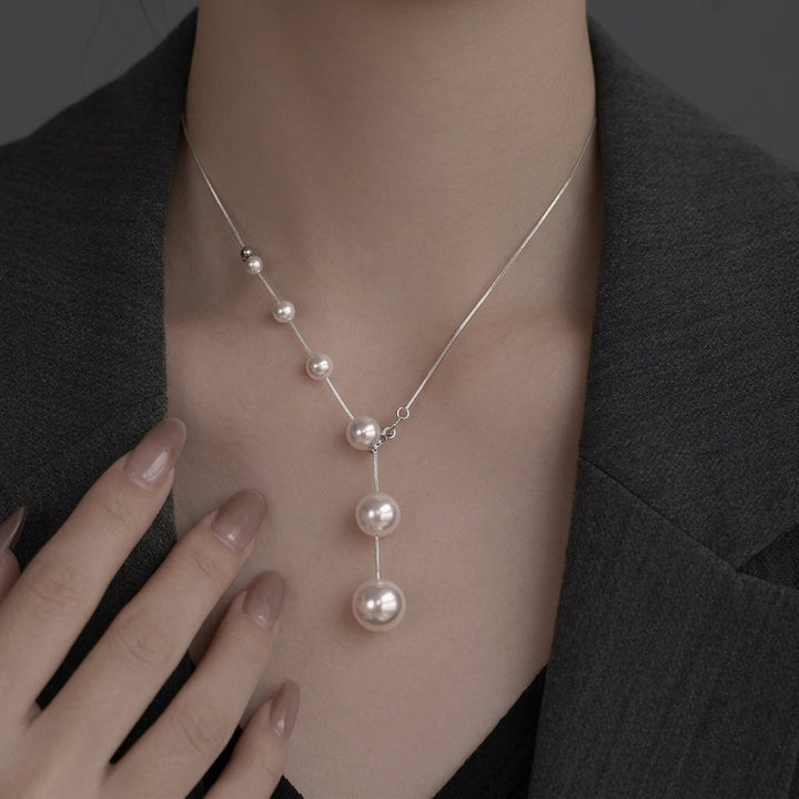 Collier élégant avec perles suspendues | Or